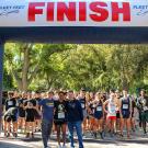 LeShelle May poses at the start of the Stride for Aggie Pride 5K race.