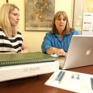 Photo: Andrea Tsatoke, left, mission continuity planner, and Joan Zimmermann, director of administration in the School of Education
