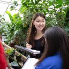 students taking notes in garden