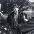 Black and white photo of Paul W. Hollingshead in 1931 carrying his photography equipment.