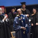 Chancellor May in academic regalia, at investiture