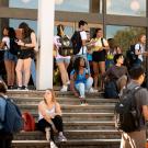 Students come and go and hang out on steps of Rock Hall.