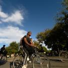 On the first day of classes, students ride their bikes through the bike circle on Hutchison Drive on September 25, 2019.