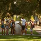 Orientation student leaders do a practice tour of campus, stopping with the Egg Head outside Mrak Hall, before Orientation Day