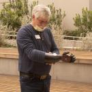 David Brockman, a retired firefighter and hand amputee, shows off his new myoelectric prosthetic device.