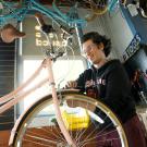 A student works on a bicycle at UC Davis. 