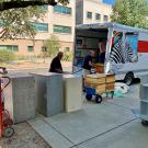Boxes being unloaded from a U-haul van 