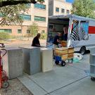 Boxes being unloaded from a U-haul van 