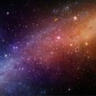 Vibrant digital space scene: blue-to-orange nebula streak with scattered stars
