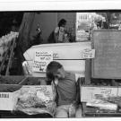 Boy resting at Davis Farmers Market. 