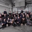 Photo of group of people dressed in black.