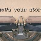 Typewriter with words What's Your Story