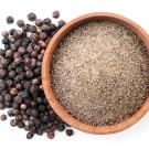 Photo of peppercorns and ground pepper