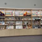 Rows of books, mugs, pillow in store display at UC Davis Gorman museum