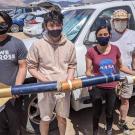 Members of the UC Davis FIRST Nations Launch team with their rocket. 