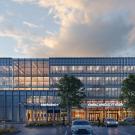 Modern glass office building at dusk with warm-lit interiors, front trees and parked car. A conceptual rendering of the entrance to the new small animal hospital. The final design is subject to change. (WRNS Studio)