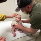 Tobi Maginnis at 3-months-old sitting on an exam table. He was one of the first babies born after a treatment involving surgery and stem cells to treat his spina bifida.