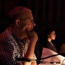 Tom Munn sitting at a desk at technical rehearsal for Tilly NoBody