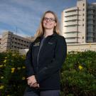 Female scientist outdoors in front of UC Davis Medical Center