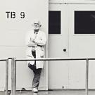 professor standing next to TB9 wall