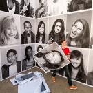 student portraits hung by student