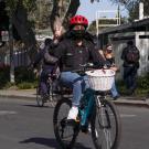 Bicyclist flashes peace sign