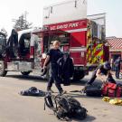 Firefighters unload Brush Truck 34 on campus.