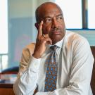 Chancellor Gary S. May sits at desk.