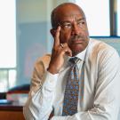 Chancellor Gary S. May sits at desk.