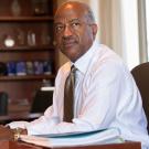 Chancellor Gary S. May sits at his desk.