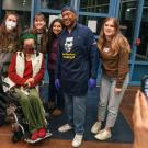 Chancellor Gary S. May poses for photo with group of students