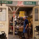 Man stands in the back of a historic restaurant