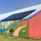 Photo illustration: Climate mural on side of barn