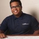 A student smiles over a city planning map