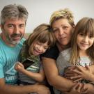 family smiling at camera