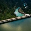 Reservoir holds back water above flowing river in Oregon