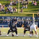 Football team lines up to take snap