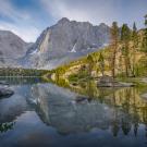 Alpine lake with backdrop of mountains in high elevations of Sequoia and Kings Canyon National Parks. 