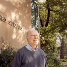 Jay Lund stands in front of sign for Watershed Sciences