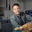 Joshua Stern examines a dog.