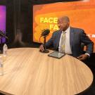 Chancellor Gary S. May with two others at round table with microphones, during recording of "Face to Face With Chancellor May"