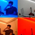 A study participant listens to music while in rooms flooded with colors of blue, musted, orangish and red