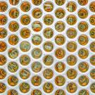 Honeycomb array of dozens of circular amber lenses in a white frame 