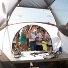 Looking out upon students near the opening of a camping tent