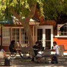 Students sit at lunch tables outside the Silo.