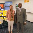 Pam Ronald and Gary S. May pose for photo in front of screens, with "Face to Face With Chancellor May" text superimposed onto the photo.