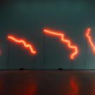 Neon sign with orange on black background