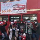 Unitrans crew in front of vintage London double-decker bus