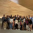 Students pose in a lobby on study abroad at UC Davis. 