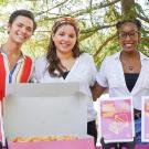 Four students, posed, tabling at the Memorial Union